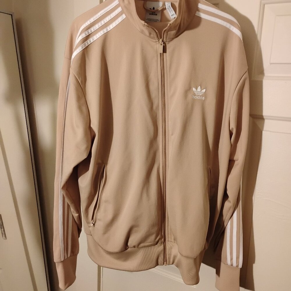 Adidas firebird tracksuit in Cream with White stripes. Brand new condition.
